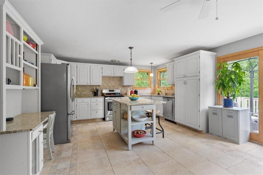 284 McKee Road Washington, PA 15301 - Photo 10 of 35 a kitchen with a refrigerator and a stove top oven