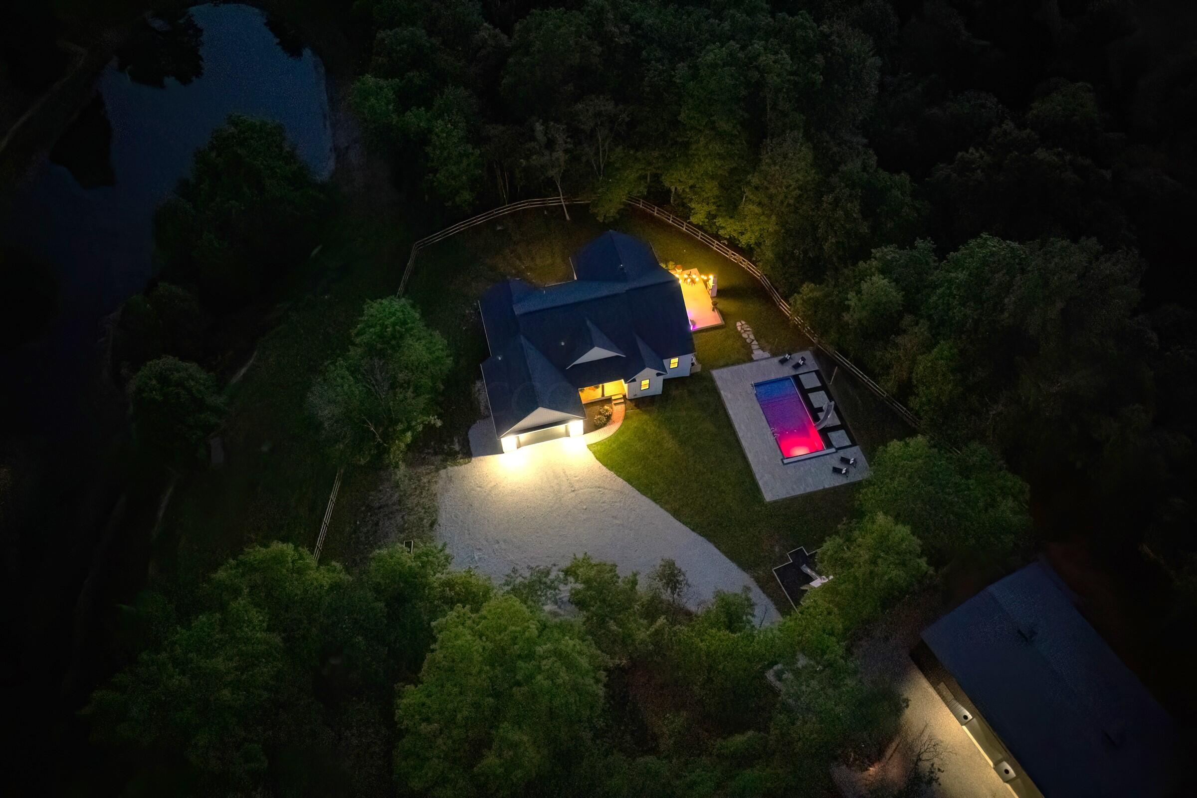 701 Ross Road Sunbury, OH 43074 - Photo 72 of 74 Nighttime drone view of the home and pool