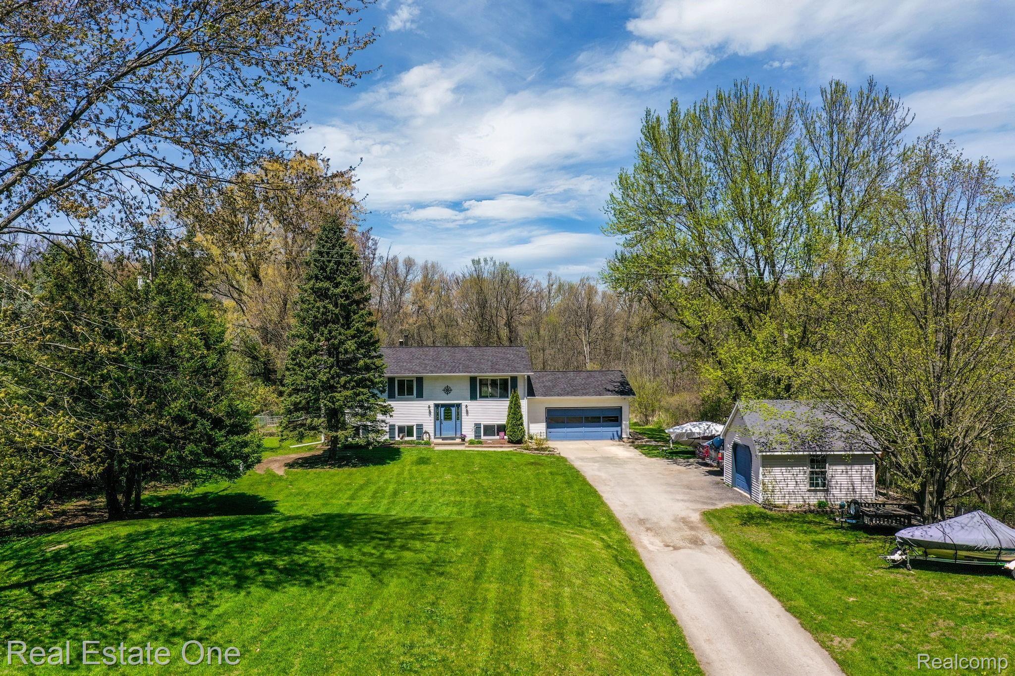 6645 Dunn Road Howell, MI 48855 - Photo 3 of 47 3 Car Garage plus an additional garage