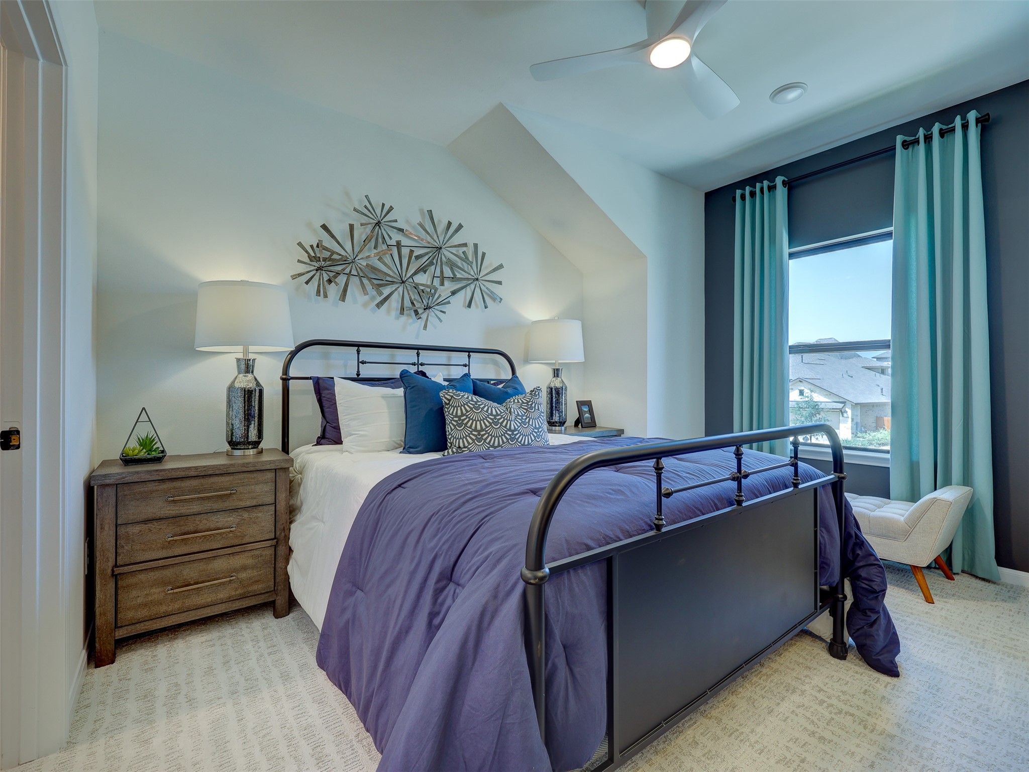 6220 Bower Well Road Austin, TX 78738 - Photo 27 of 28 A comfortable bedroom features plush carpeting and a large window, creating a serene personal retreat.