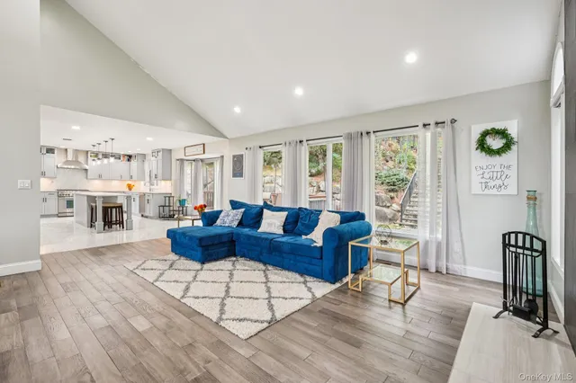 a spacious bedroom with a bed and large windows