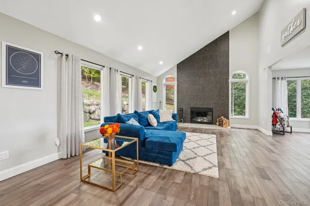 a bathroom with a double vanity sink toilet mirror and shower