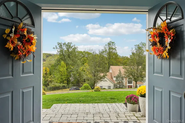 a view of a dining room with furniture wooden floor and chandelier