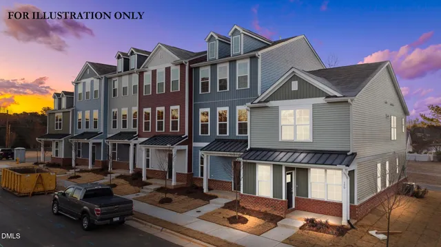 a front view of residential houses with yard