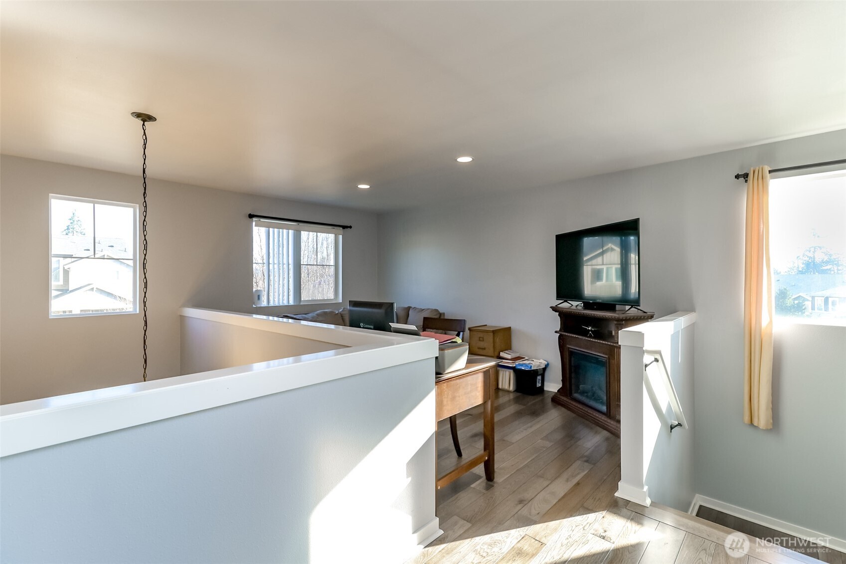 6820 9th Street East Fife, WA 98424 - Photo 17 of 40 a living room with furniture and a flat screen tv