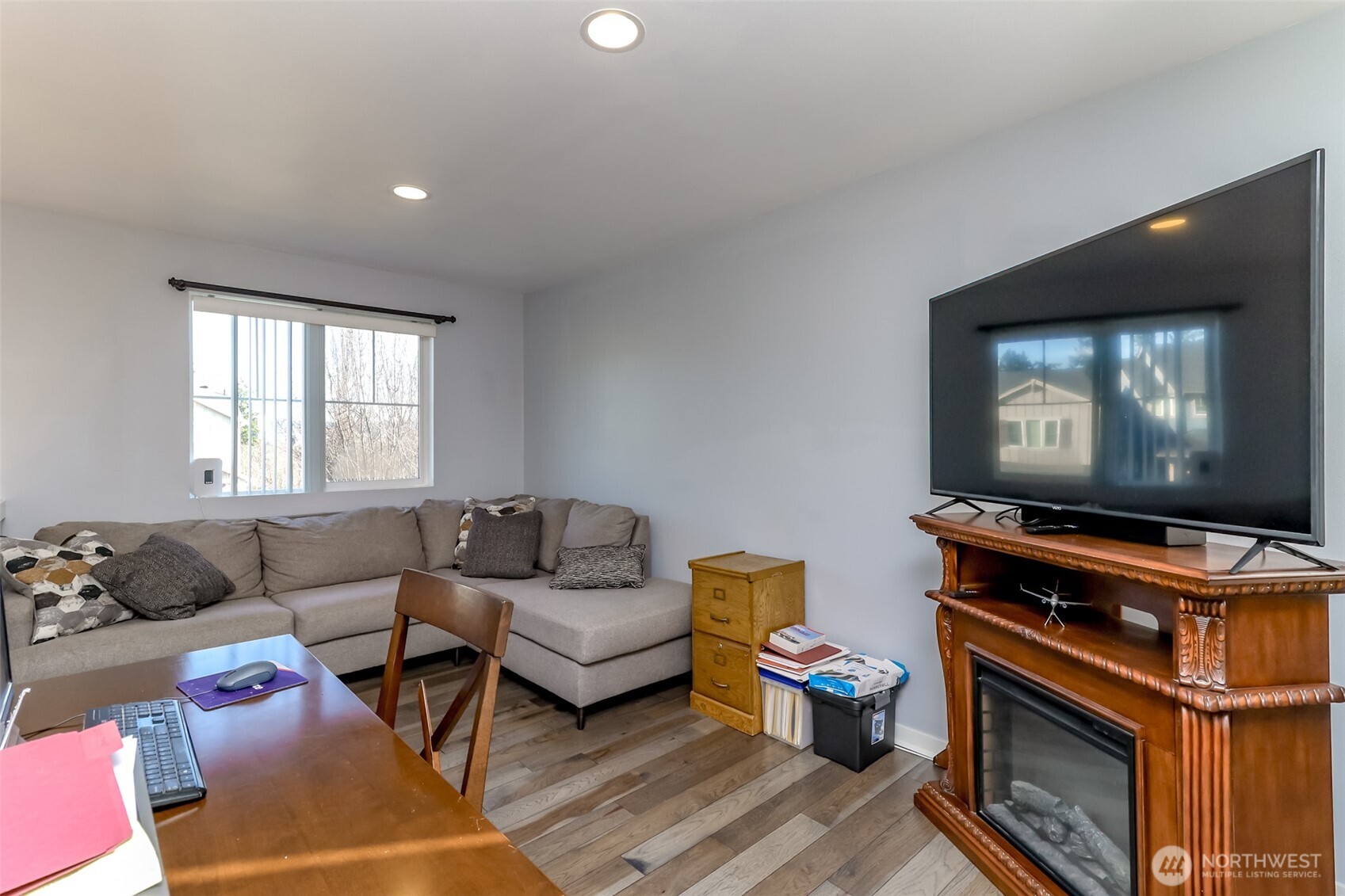 6820 9th Street East Fife, WA 98424 - Photo 18 of 40 a living room with furniture and a flat screen tv