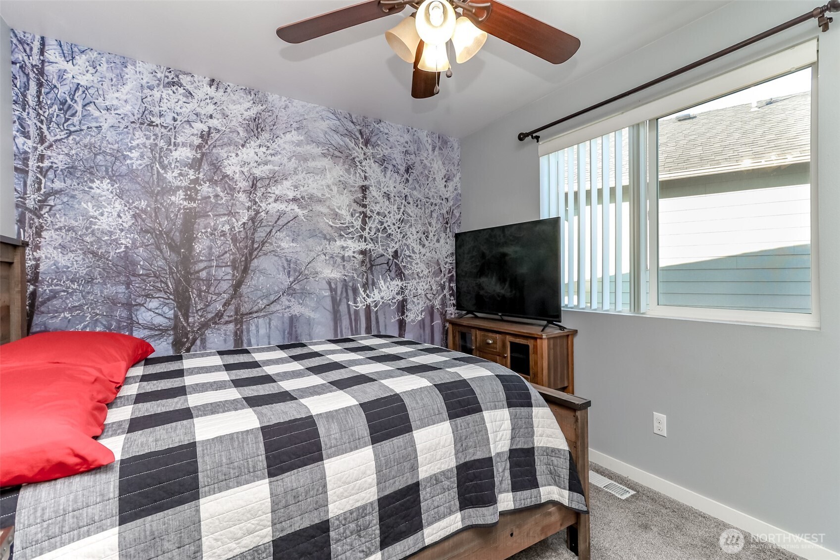 6820 9th Street East Fife, WA 98424 - Photo 24 of 40 a bedroom with a bed and a flat screen tv
