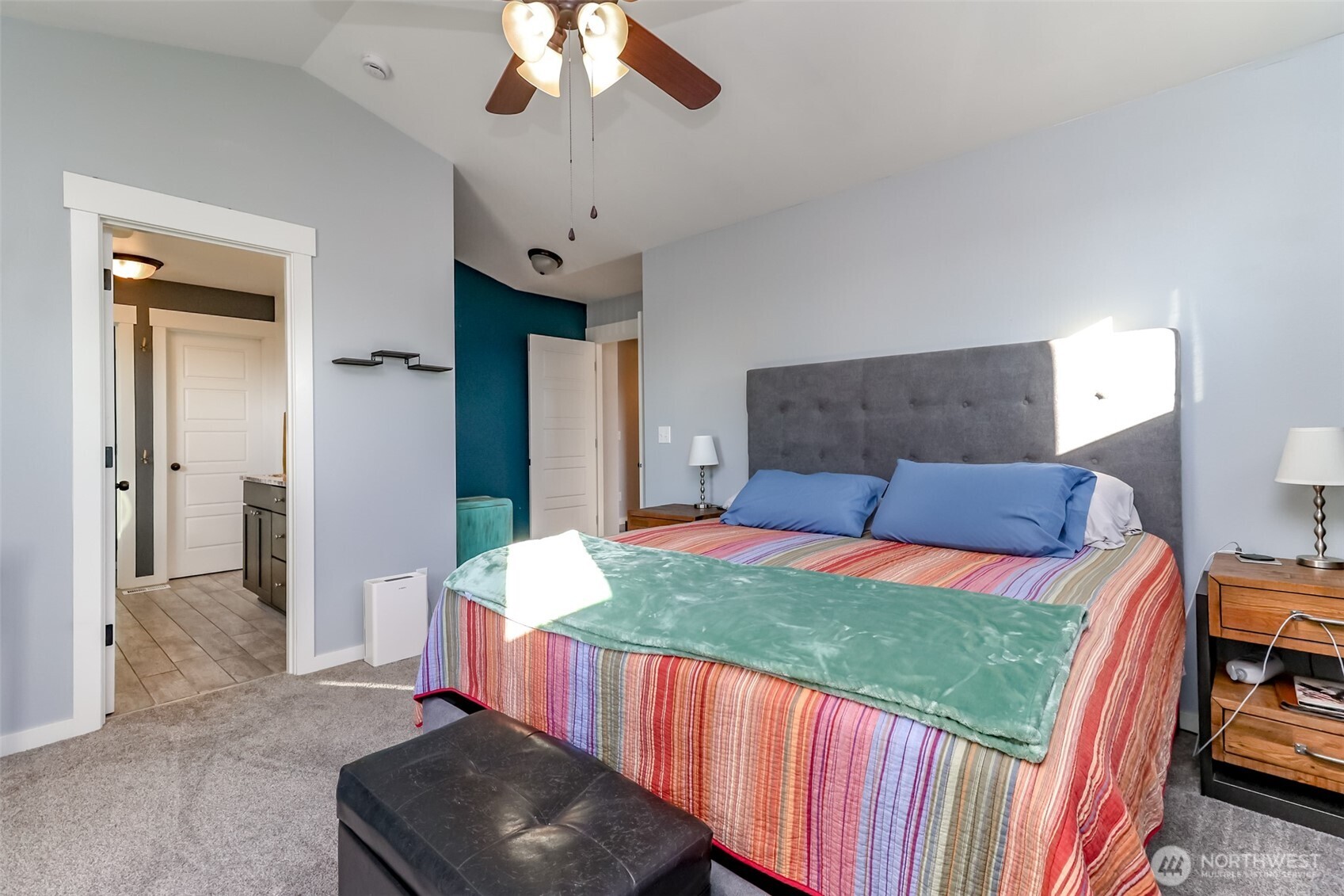 6820 9th Street East Fife, WA 98424 - Photo 25 of 40 a bedroom with a bed and a chandelier