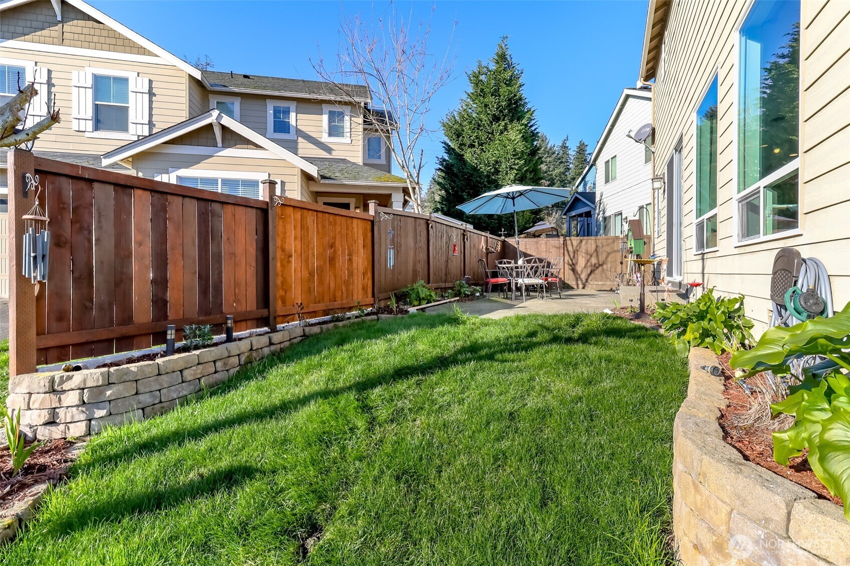 6820 9th Street East Fife, WA 98424 - Photo 30 of 40 a front view of a house with garden