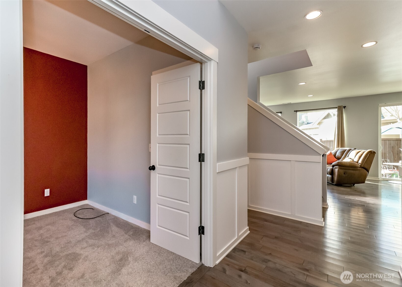 6820 9th Street East Fife, WA 98424 - Photo 3 of 40 a view of a livingroom with wooden floor and stairs