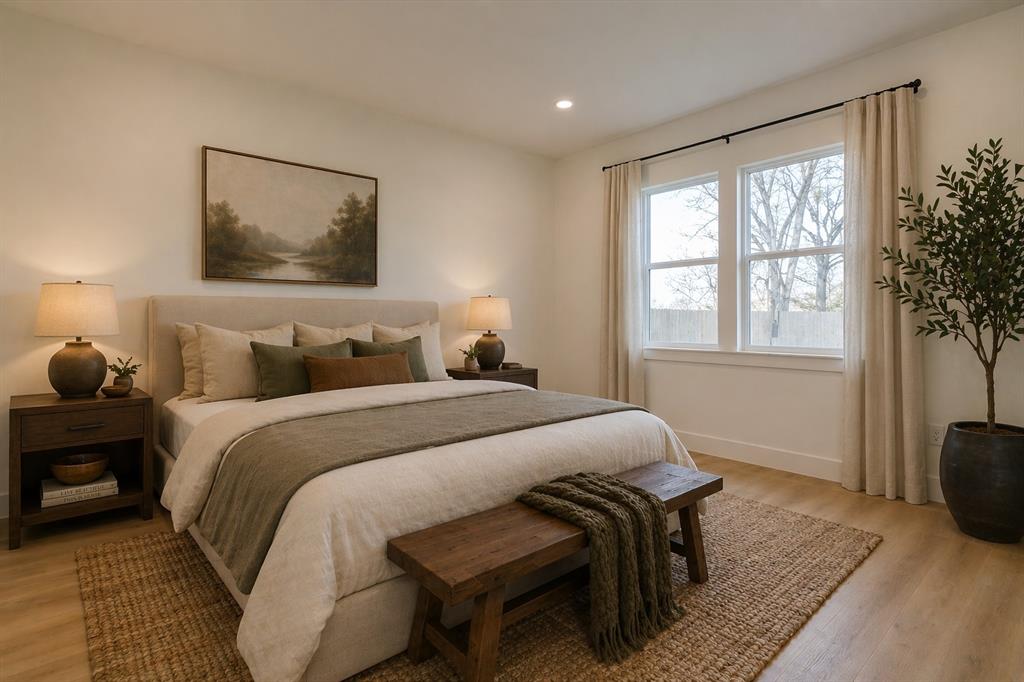 1507 Elk Creek Road Dallas, TX 75253 - Photo 15 of 40 a bedroom with bed and wooden floor