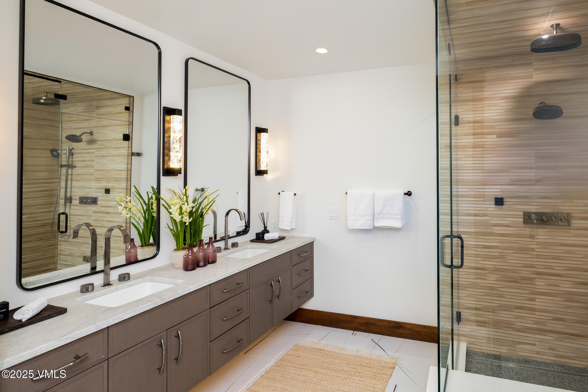 200 Goldfinch Lane, Unit 1B Avon, CO 81620 - Photo 12 of 31 a bathroom with a double vanity sink mirror and shower