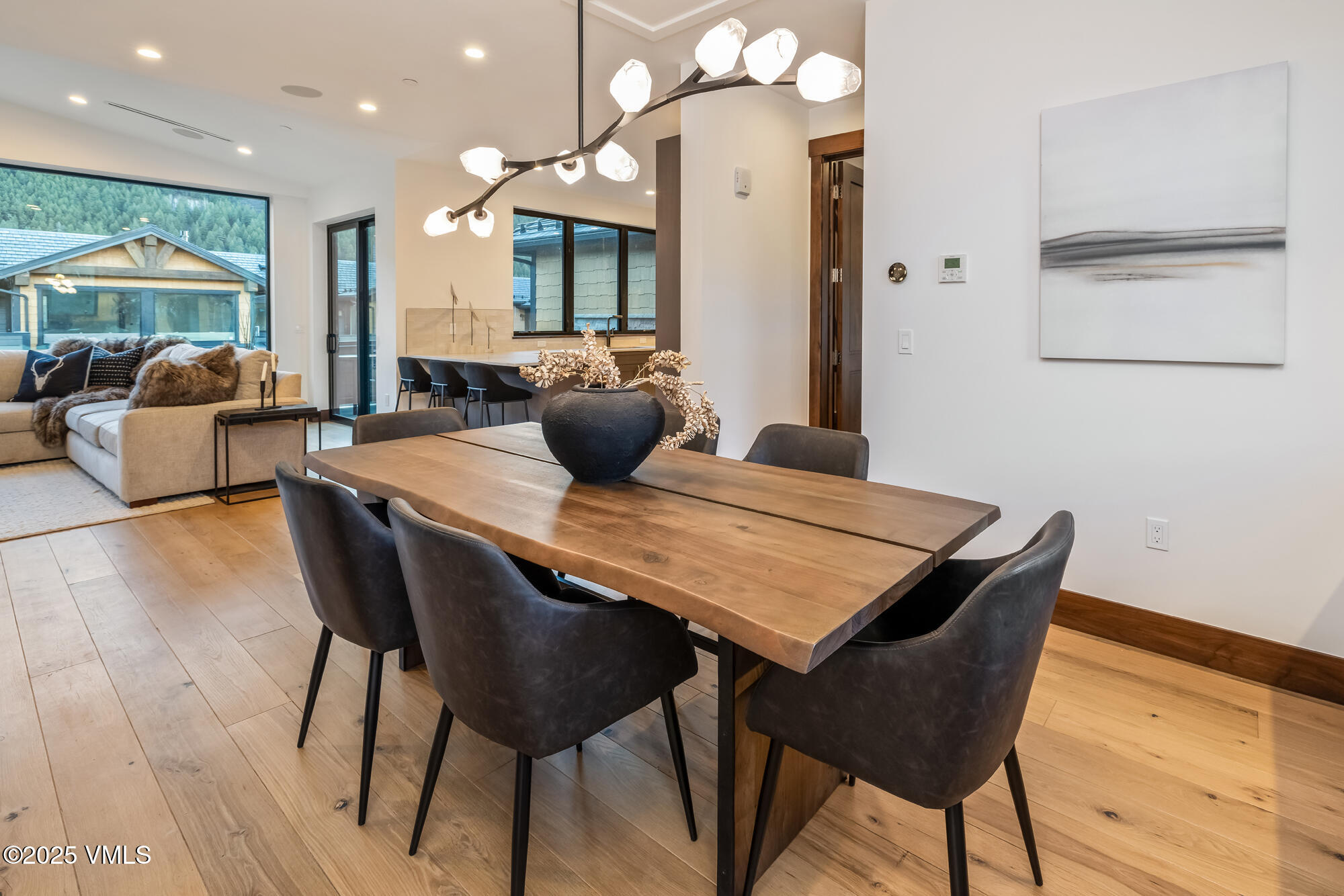 200 Goldfinch Lane, Unit 1B Avon, CO 81620 - Photo 8 of 31 a view of a dining room with furniture and wooden floor