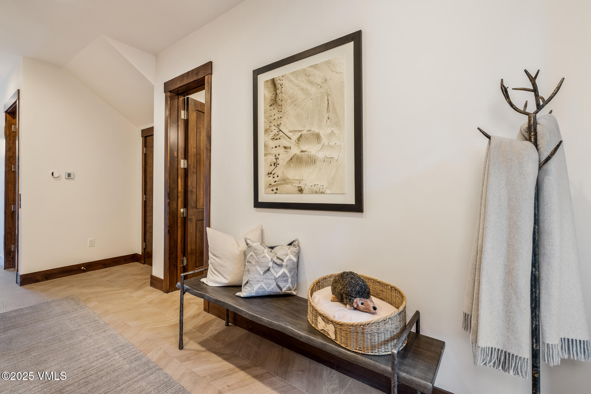 200 Goldfinch Lane, Unit 1B Avon, CO 81620 - Photo 10 of 31 a living room with furniture and a wall painting