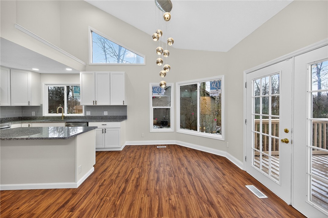 811 Wind Bluff Point Springboro, OH 45066 - Photo 7 of 51 This bright kitchen with deck access provides a perfect space for culinary creativity and entertaining.