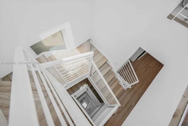 a view of entryway with wooden floor