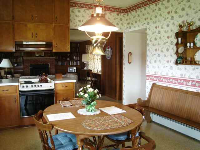 5298 North Afolkey Road Freeport, IL 61032 - Photo 8 of 9 a kitchen with a table chairs and a stove
