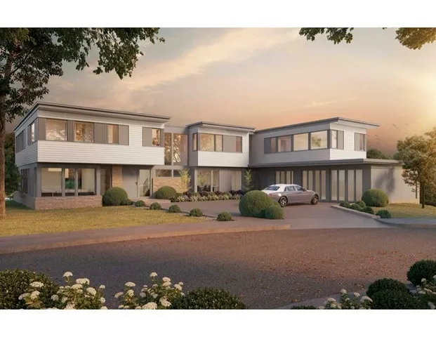 a view of a big house with a patio and a yard