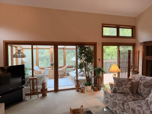 235 Elm Grove Road, Unit A Brookfield, WI 53005 - Photo 6 of 41 View to Sunroom and Deck