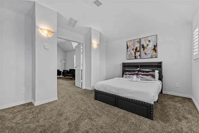 a view of a bathroom with sink and mirror