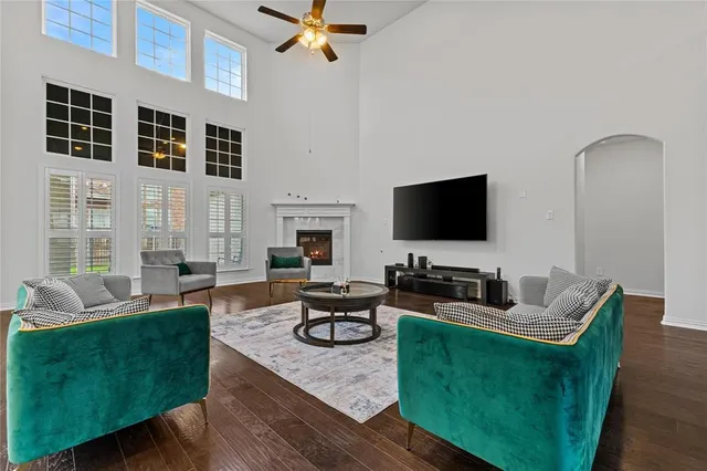 a front view of a house with a garden and plants