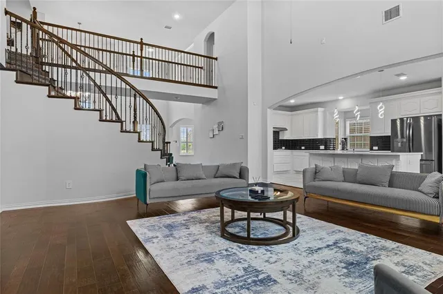 a living room with furniture and a rug