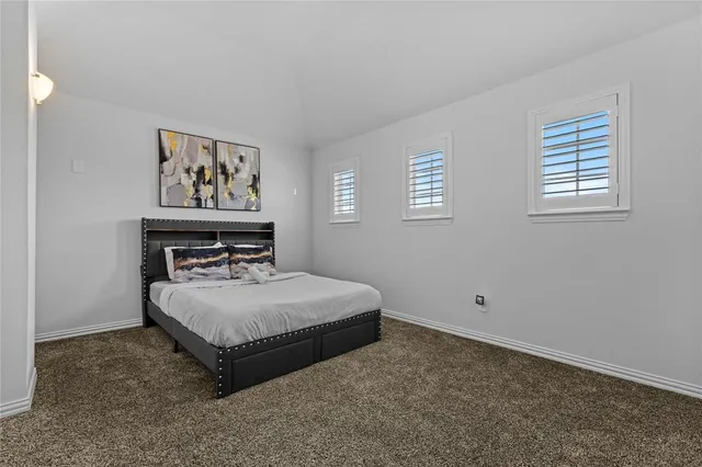 a bed room with a bed and a table