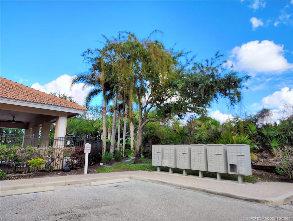 414 Southwest Walking Path, Unit 414 Stuart, FL 34997 - Photo 15 of 15 a view of a house with a patio
