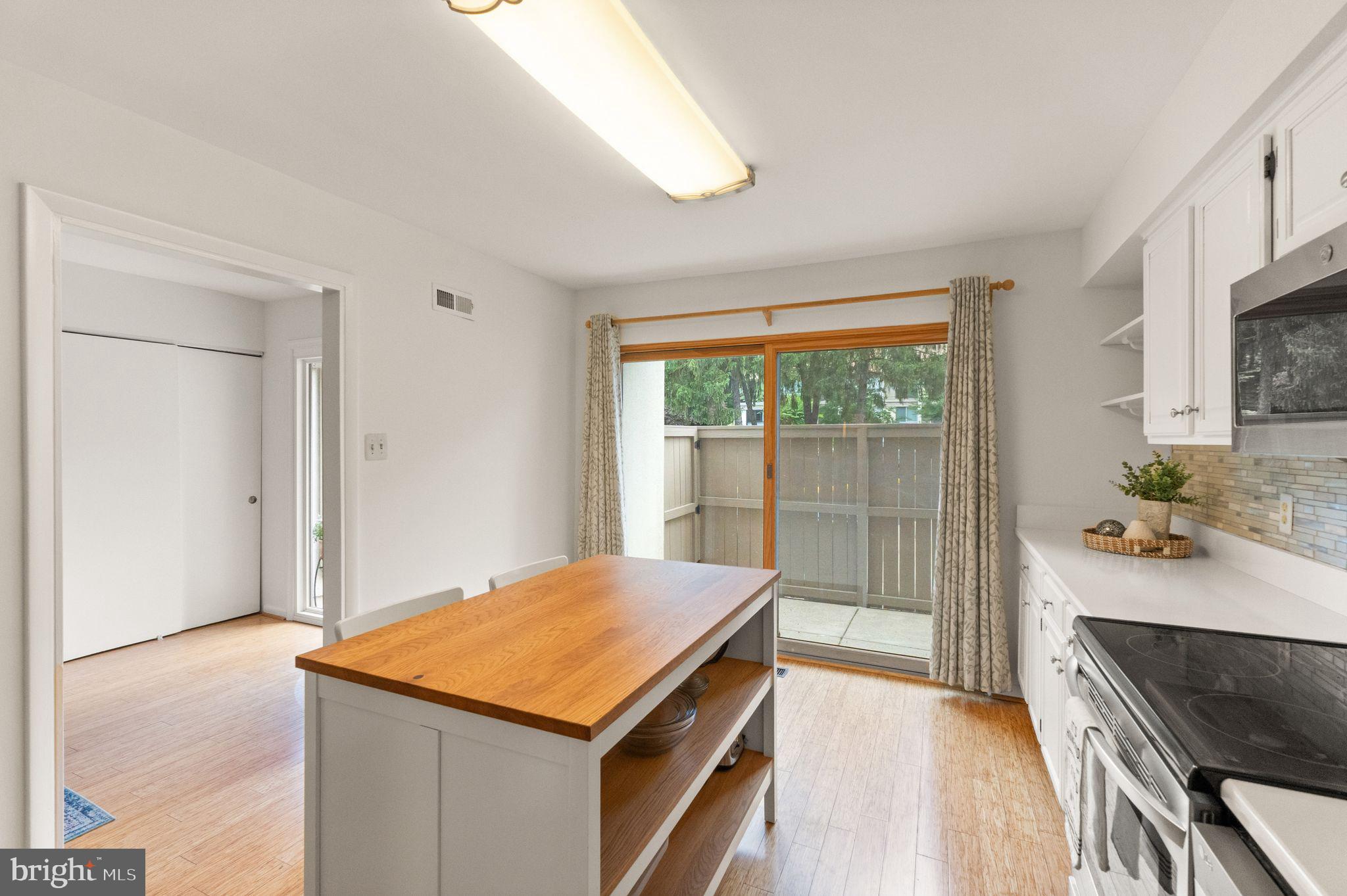 11645 Newbridge Court Reston, VA 20191 - Photo 12 of 62 a kitchen with a stove and a refrigerator