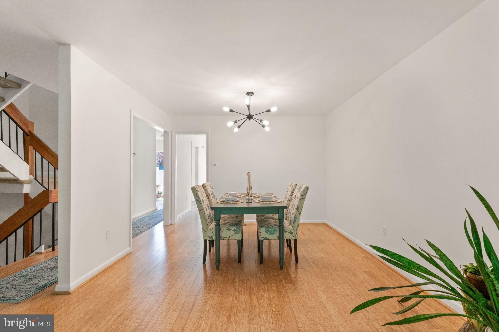11645 Newbridge Court Reston, VA 20191 - Photo 18 of 62 a view of a dining room with furniture and wooden floor