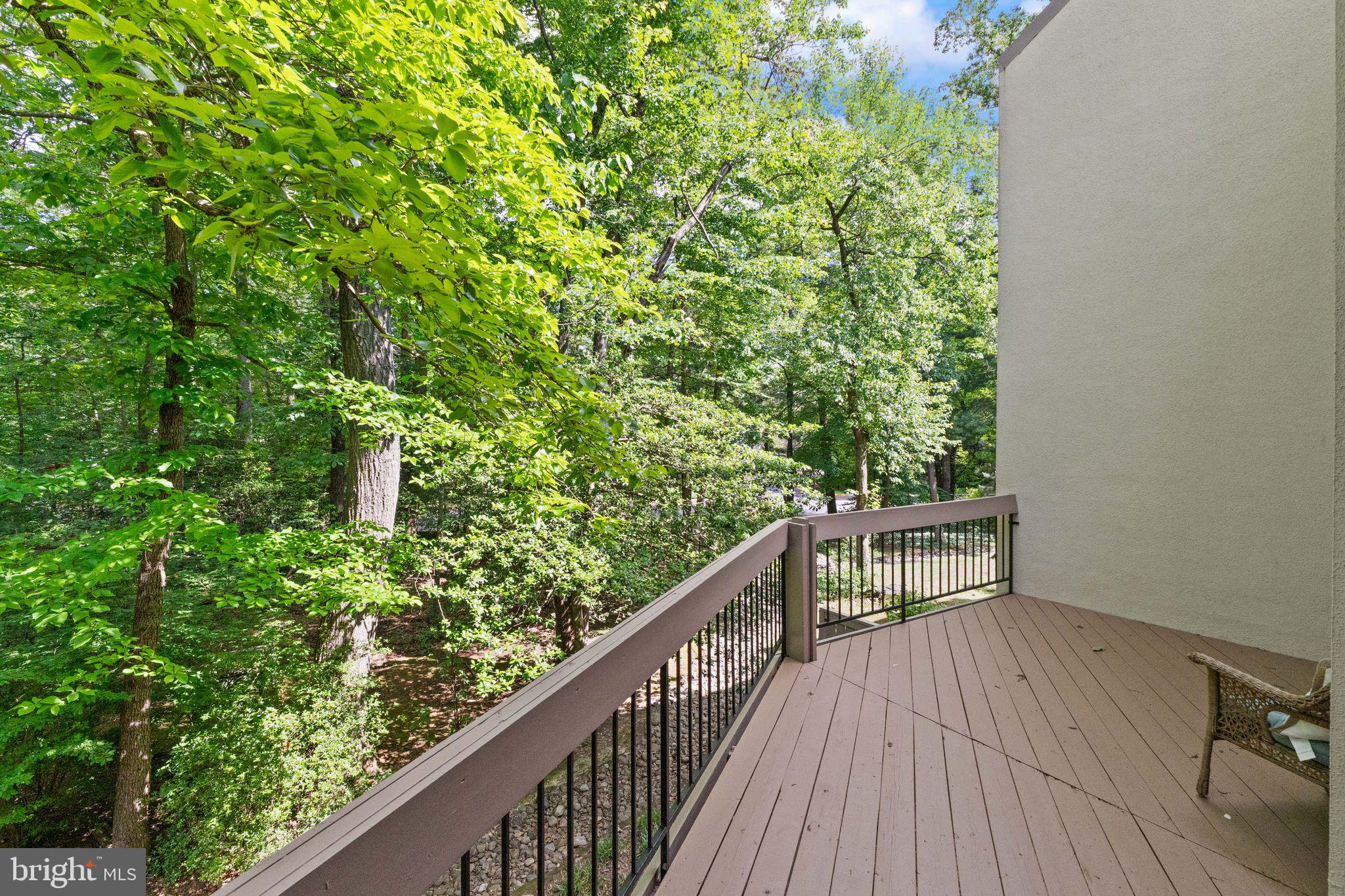 11645 Newbridge Court Reston, VA 20191 - Photo 20 of 62 a balcony with wooden floor and deck