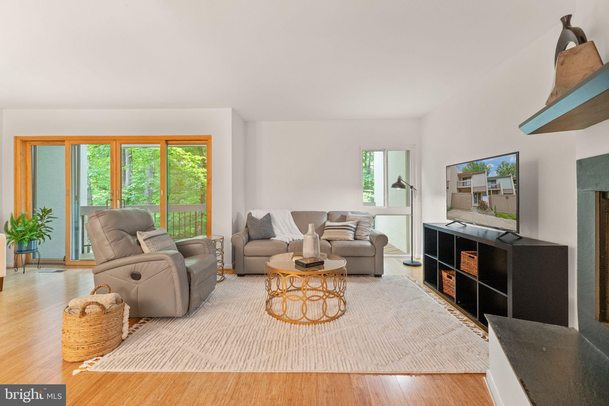 11645 Newbridge Court Reston, VA 20191 - Photo 25 of 62 a living room with furniture and a flat screen tv