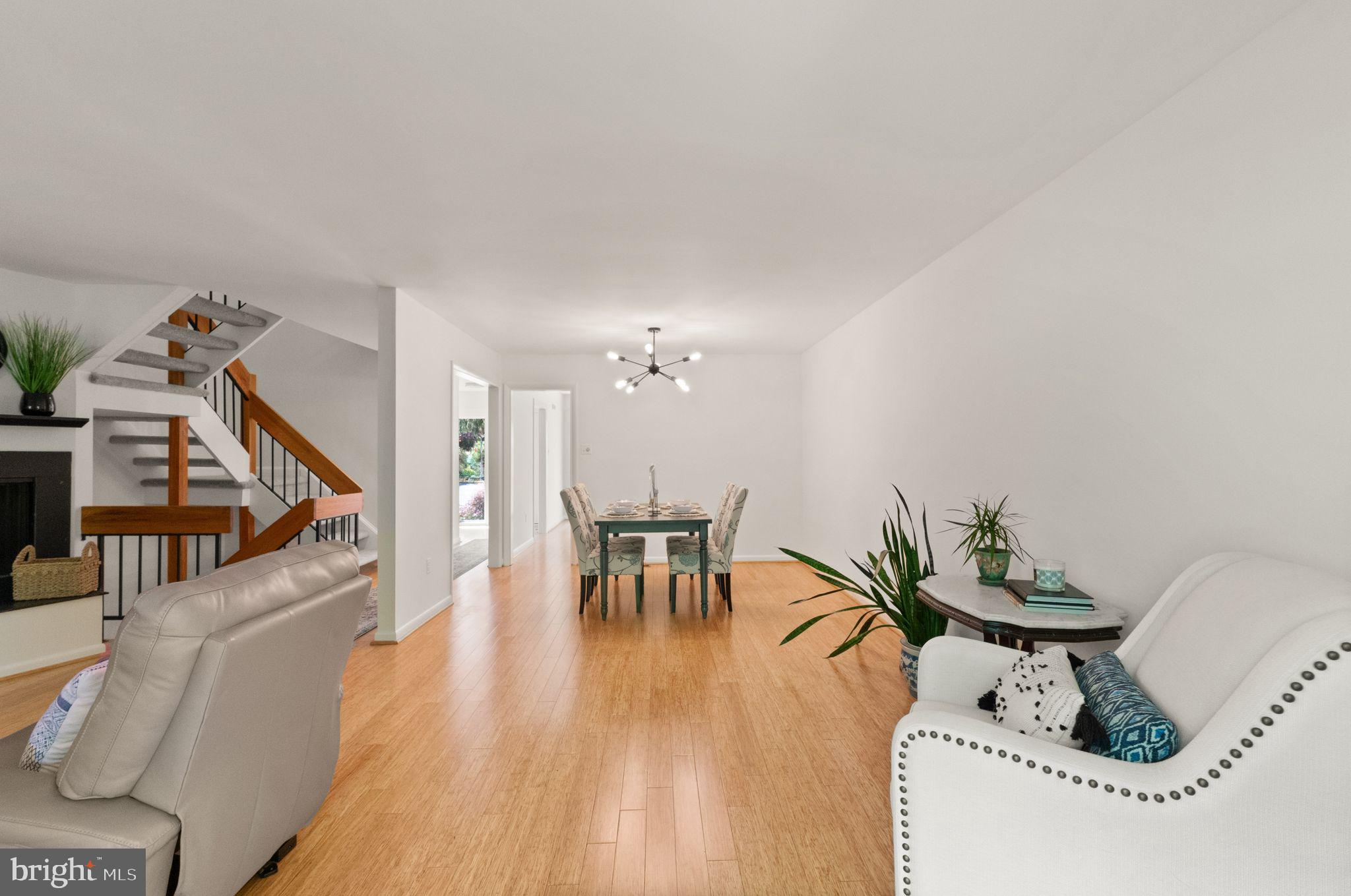 11645 Newbridge Court Reston, VA 20191 - Photo 26 of 62 a view of a dining room with furniture and wooden floor