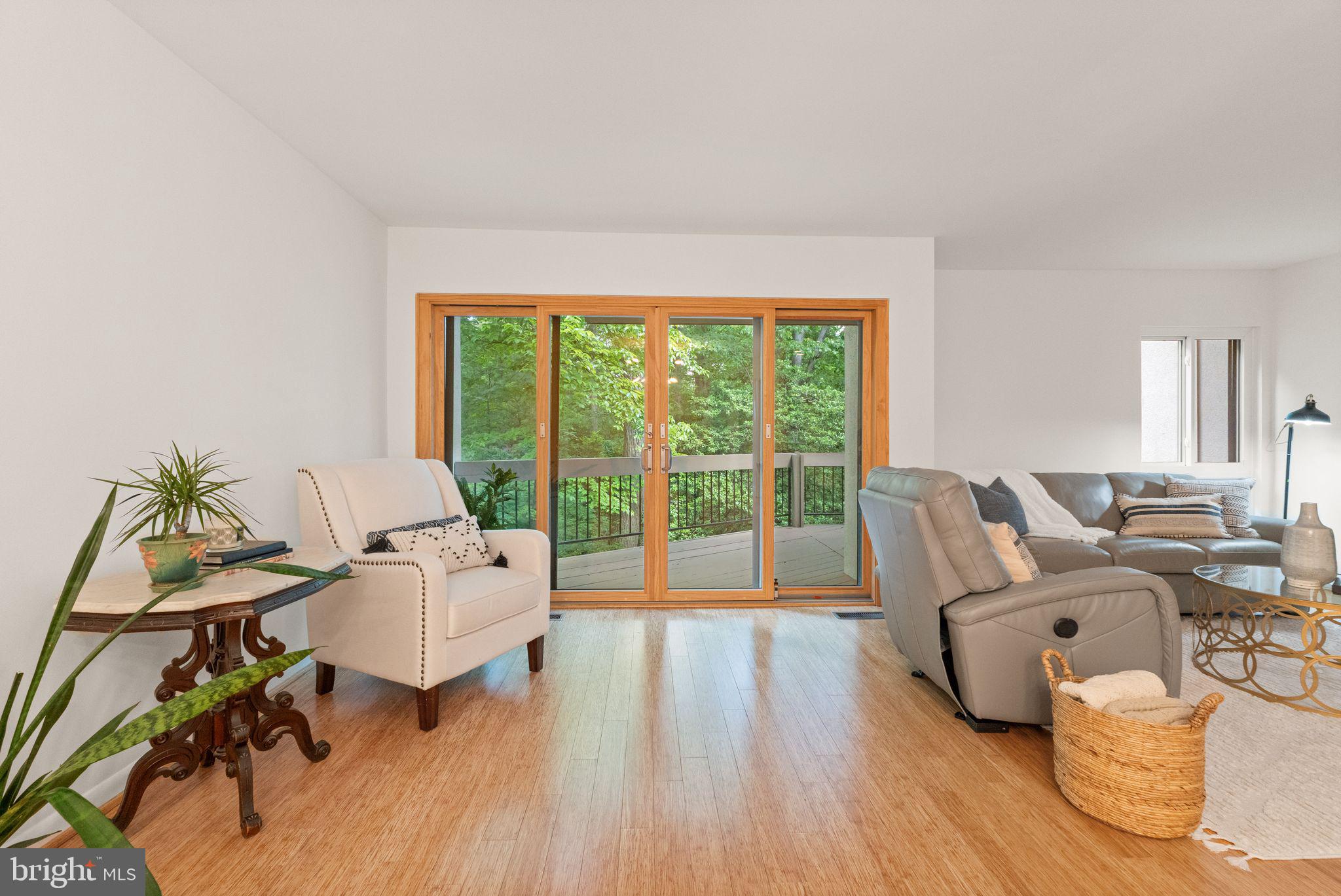 11645 Newbridge Court Reston, VA 20191 - Photo 28 of 62 a living room with furniture and a wooden floor