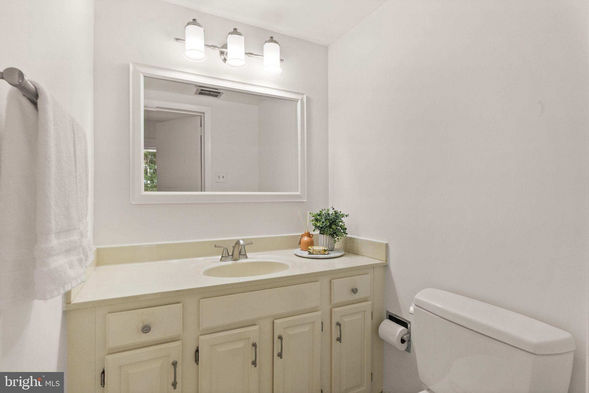 11645 Newbridge Court Reston, VA 20191 - Photo 33 of 62 a bathroom with a sink vanity and toilet