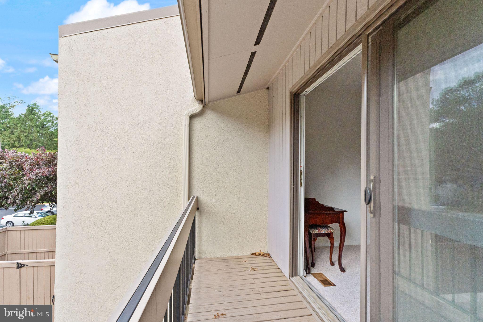 11645 Newbridge Court Reston, VA 20191 - Photo 40 of 62 a view of a hallway with wooden floor and staircase