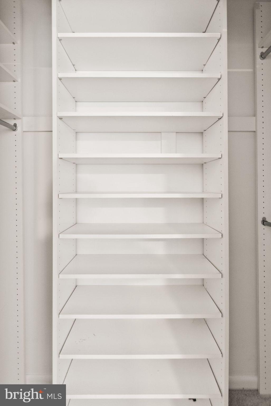 11645 Newbridge Court Reston, VA 20191 - Photo 44 of 62 a view of walk in closet with empty racks