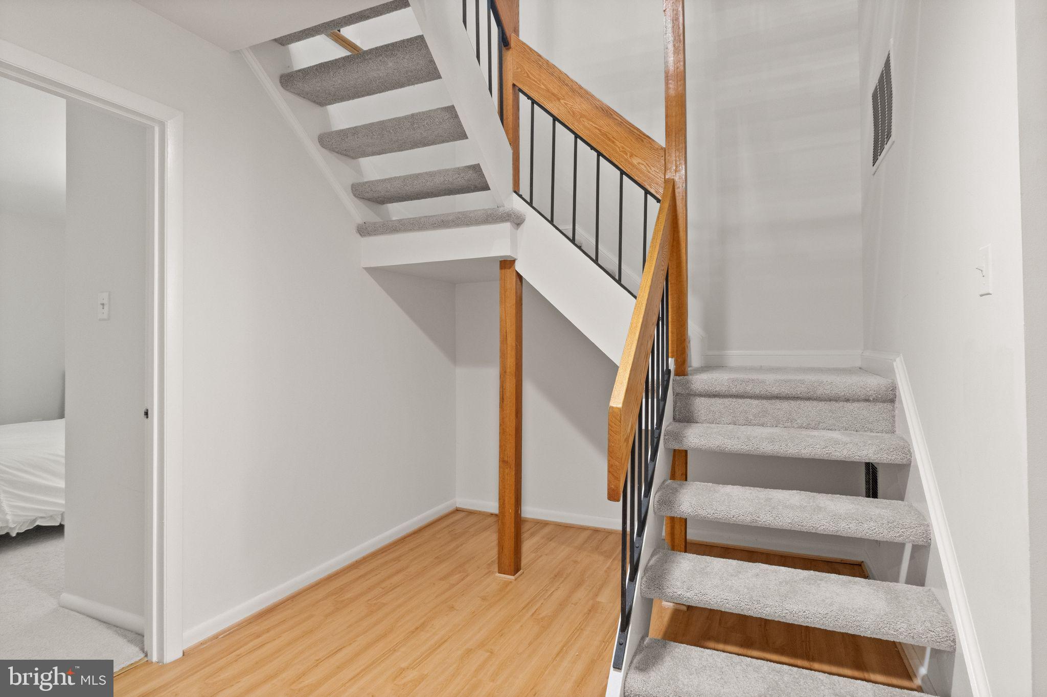 11645 Newbridge Court Reston, VA 20191 - Photo 53 of 62 a view of entryway and hall with wooden floor