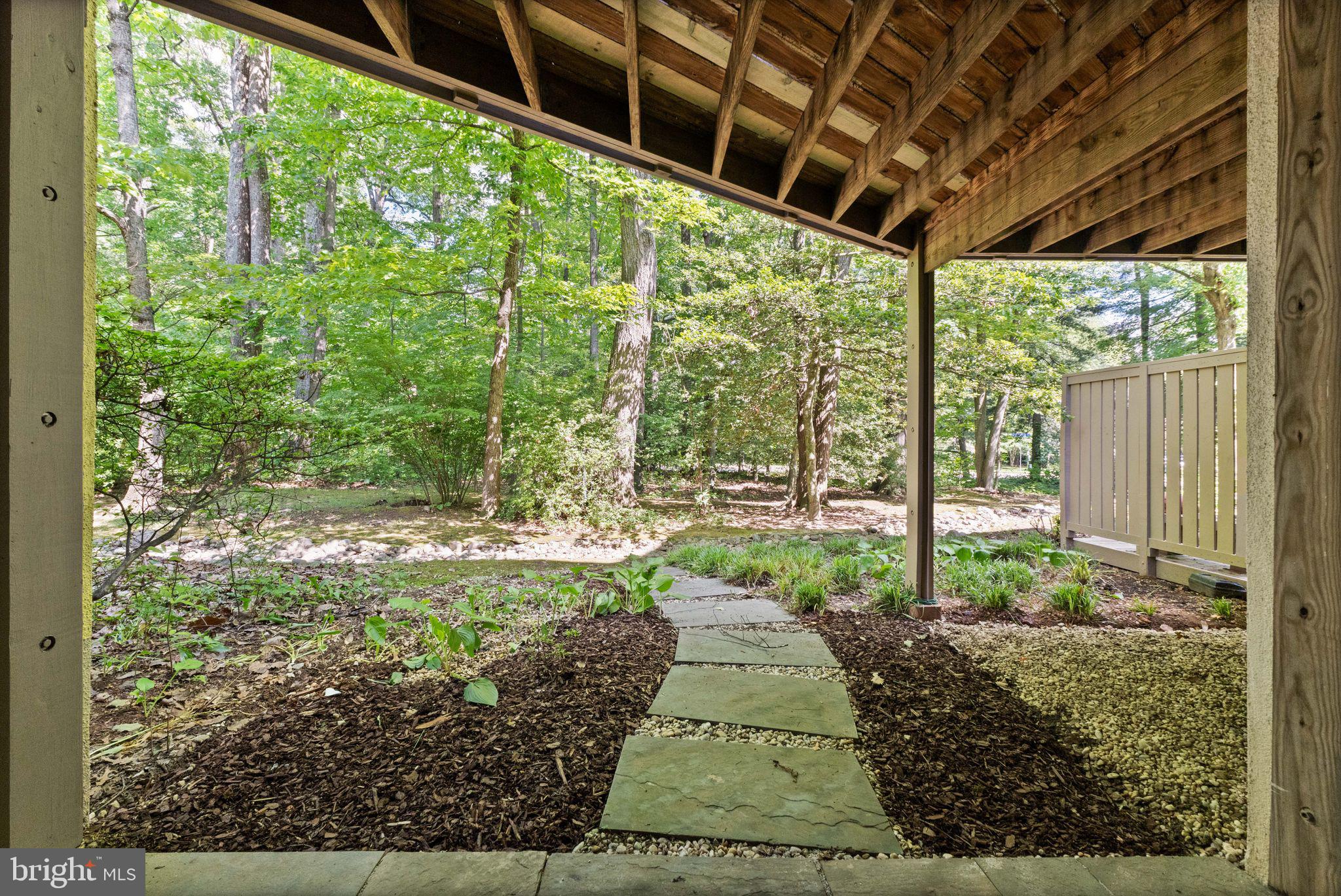 11645 Newbridge Court Reston, VA 20191 - Photo 60 of 62 a view of a backyard with pathway