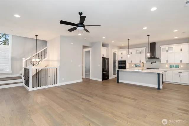 a view of kitchen with refrigerator and window