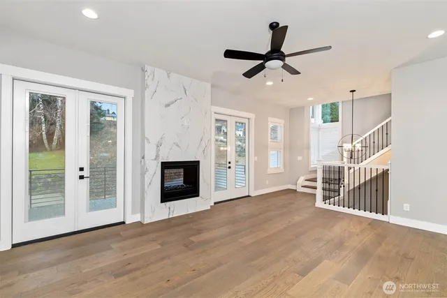 wooden floor in an empty room with a fireplace