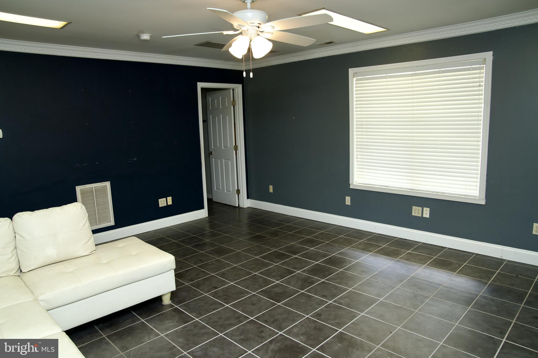 31867 Shavox Road Salisbury, MD 21804 - Photo 45 of 64 a living room with a couch and a bookshelf
