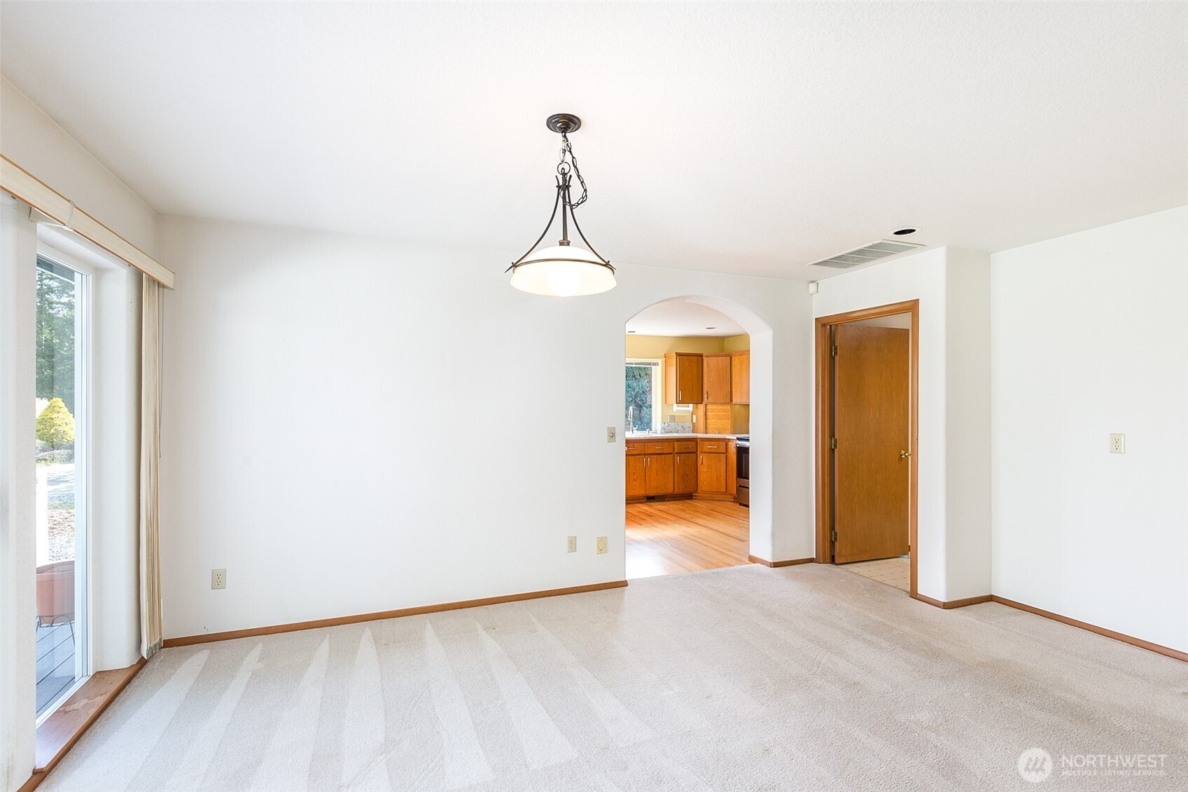 170 Hurricane Ridge Drive Sequim, WA 98382 - Photo 18 of 39 a view of a room with a chandelier and wooden floor