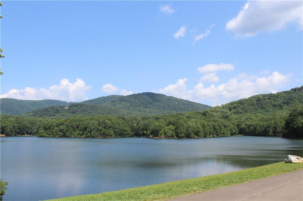 0 Denny Ridge Road Jasper, GA 30143 - Photo 17 of 44 a view of a lake with mountains in the background