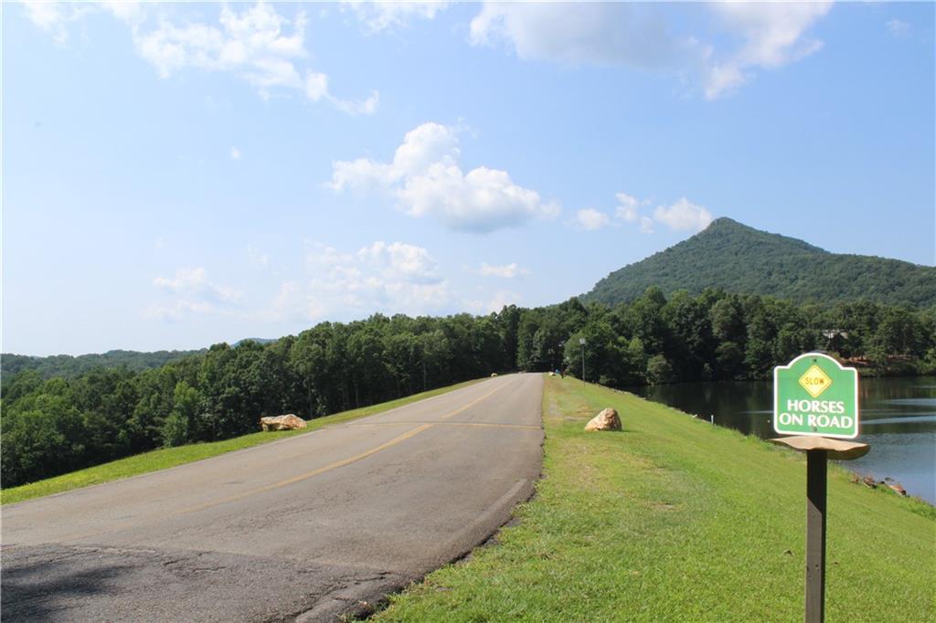 0 Denny Ridge Road Jasper, GA 30143 - Photo 27 of 44 a view of a street with a houses with in the background