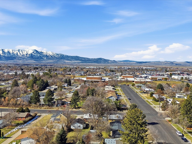 322 East 900 North Logan, UT 84321 - Photo 41 of 43 Aerial view of residential area featuring a mountain backdrop