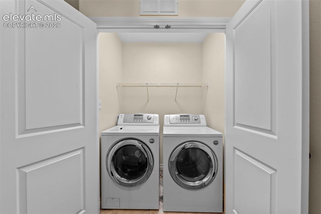16540 Mesquite Road Peyton, CO 80831 - Photo 24 of 50 a utility room with dryer and washer
