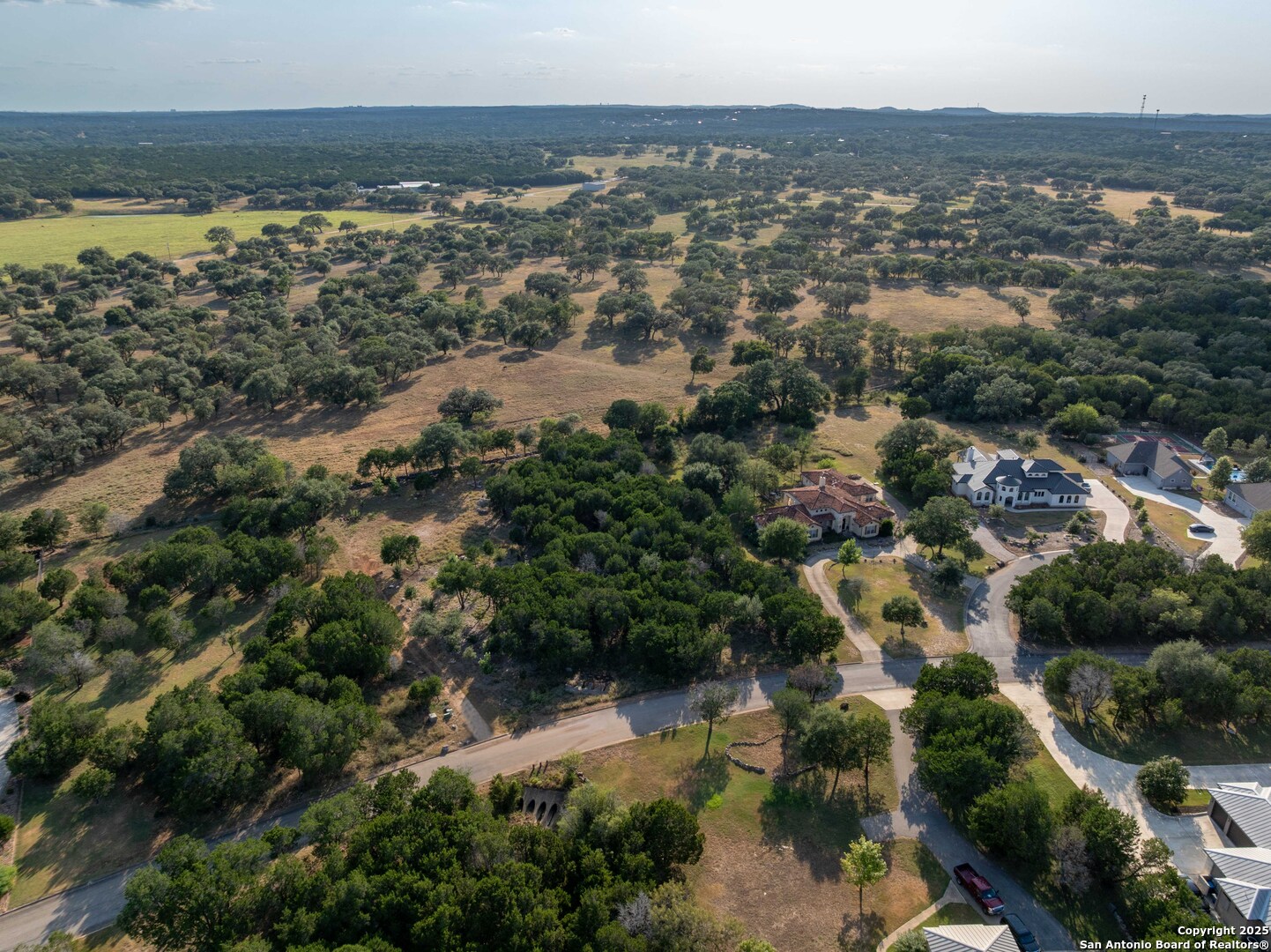 27919 Bogen Road New Braunfels, TX 78132 - Photo 17 of 23 an aerial view of residential houses with outdoor space and trees