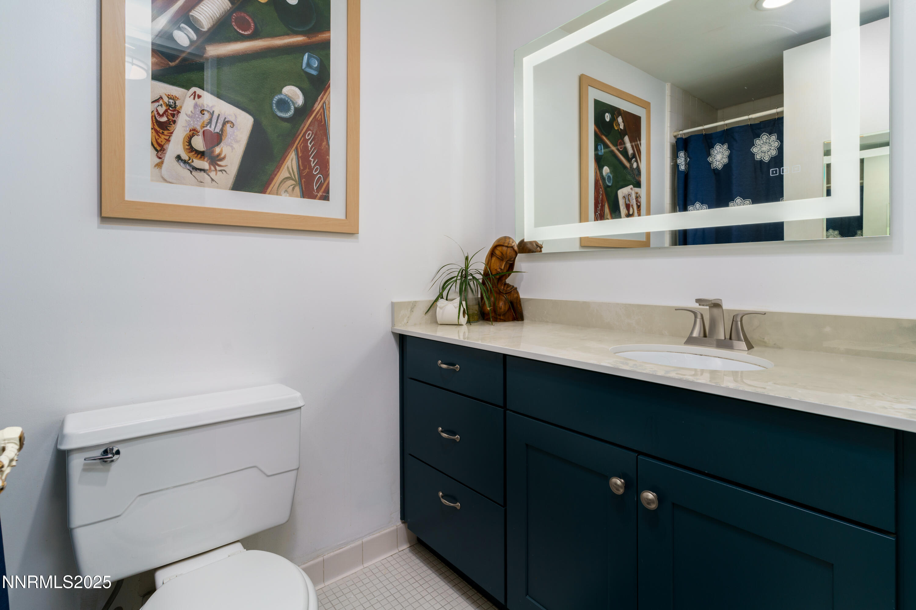 100 North Arlington Avenue, Unit 7I Reno, NV 89501 - Photo 13 of 25 a bathroom with a toilet sink and mirror