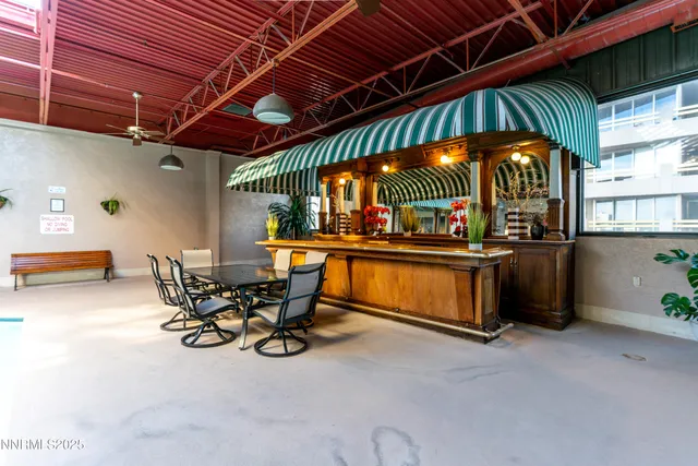 a view of a chairs and table in a room